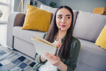 Photo of pretty young lady notebook contemplate wear green shirt weekend modern apartment indoors