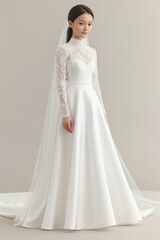 Fototapeta premium A bride wearing a long-sleeve lace wedding dress stands gracefully, showcasing elegance and sophistication with a full skirt and a long flowing veil