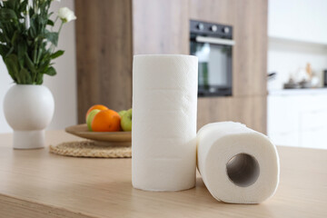 Rolls of paper towels on table in kitchen, closeup