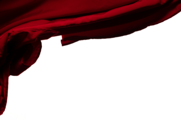 Red curtain fabric flying in curve shape, Piece of textile red curtain fabric throw fall in air. White background isolated, dark shading environment