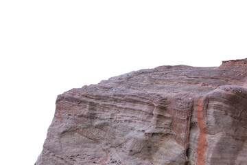 The section of a rugged, stratified rock formation with layers of reddish-brown and grey hues. The rock's surface is weathered and textured.