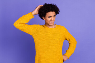 Photo of worried man wear stylish clothes arm touch head look down empty space isolated on purple...