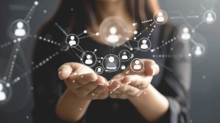 Obraz premium A businesslady is holding a network of digital human resource icons