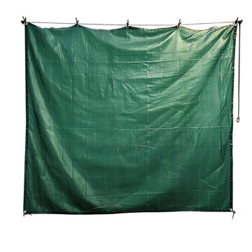 Green plastic tarp with metal grommets. Durable material for outdoor and construction purposes. Isolated on white background.