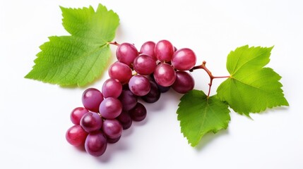 Red grapes with green leaves and half sliced  on white background. 