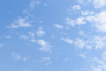 beautiful blue sky and white fluffy group of clouds with sunrise in the morning, natural background