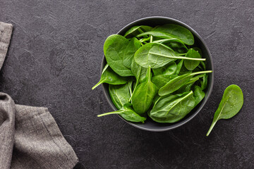 Fresh green spinach leaves in the bowl. Natural vegetarian food.