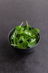 Fresh green spinach leaves in the bowl. Natural vegetarian food.