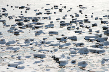 View of the broken ice on the frozen seaside