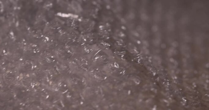 old air cellophane with a lot of bubbles for safe storage of things, close-up of a protective film with air bubbles