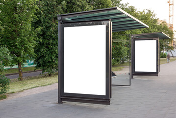 Two Blank Mockups Of Bus Stop Advertising Poster Billboards. White Empty Outdoor Ad Lightboxes On...