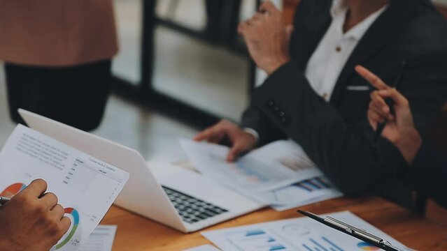 Team of business people are meeting to analyze data for marketing plan,Market research reports and income statistics, Financial and Accounting concept.