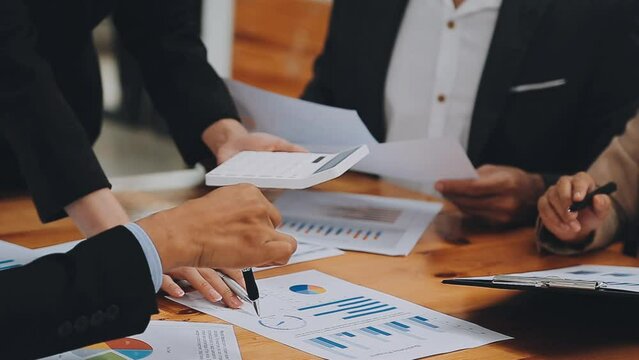 Team of business people are meeting to analyze data for marketing plan,Market research reports and income statistics, Financial and Accounting concept.
