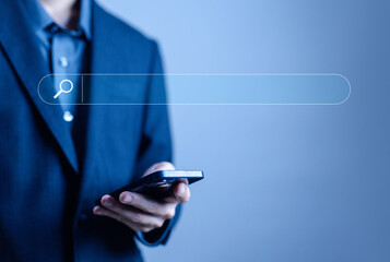 businessman using a smartphone to search engine. concept of keywords show a search bar. web browser...