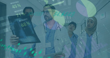 Diverse group of colleagues, including senior supervisor, analyzing medical data on a tablet