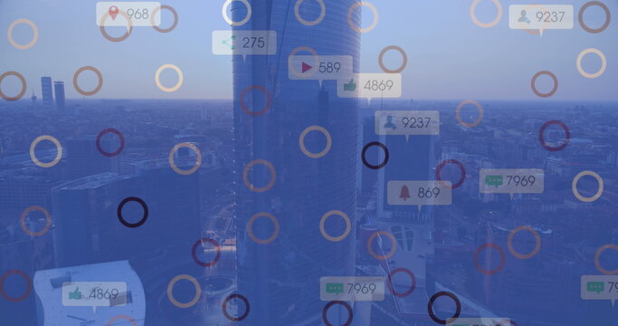 Image of digital notifications overlaying cityscape with a tall modern building