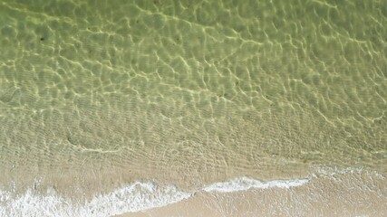Crystal Clear Ocean Water With Waves Running Ashore In Dennis Port, Nantucket Sound, Massachusetts. aerial topdown shot