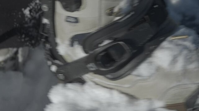A person prepares to splitboard in snowy Iwanai, Hokkaido, Japan near Niseko resort