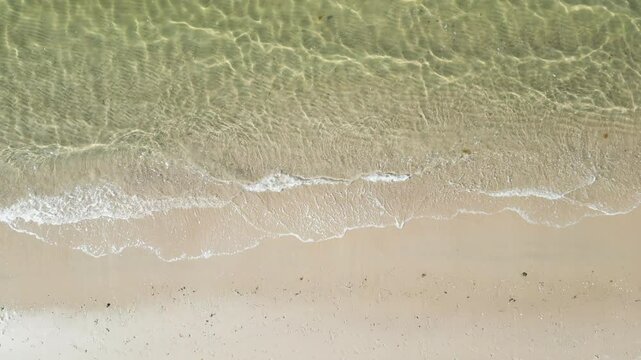 View From Above Of Sandy Shore With Ocean Waves At Beach In Dennis Port, Cape Cod, Massachusetts. aerial topdown shot