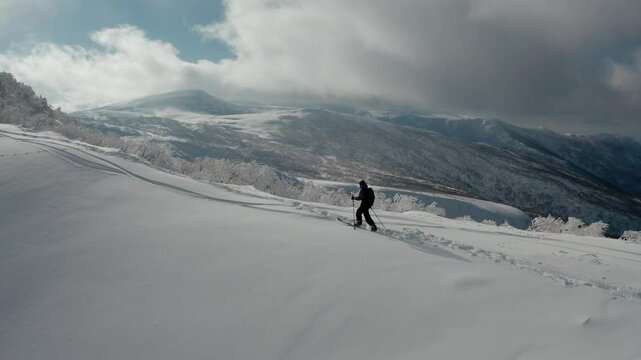Splitboarding in Hokkaido's snow-covered Iwanai with stunning mountain views