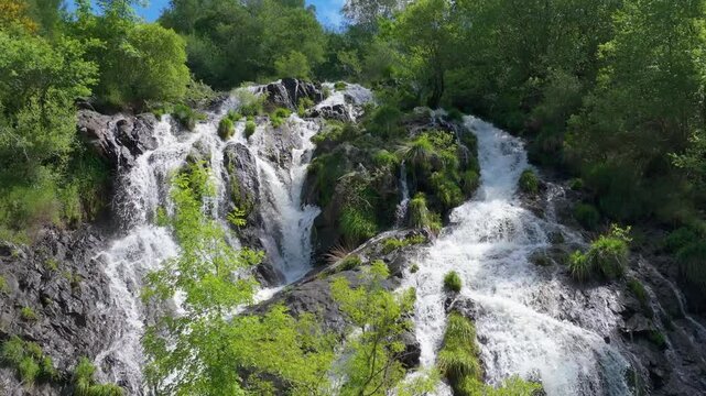 Majestic Waterfall Of Furelos River In Toques, Melide, A Coruna, Galicia, Spain. Aerial Drone Shot
