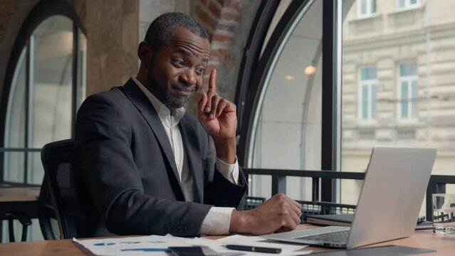 African American middle-aged entrepreneur thinking create using computer pc working thoughtful solution hesitate decision think find with idea man business office businessman male guy typing laptop