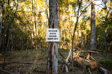 Warning sign, rifle range, keep out, live firearms guns shooting danger