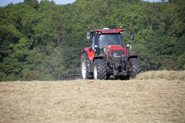 red tractor in a field 