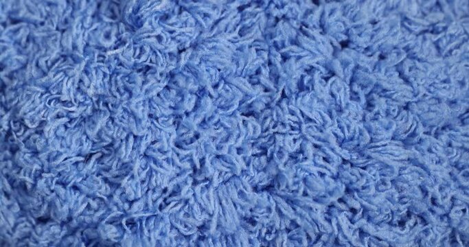 lint blue soft knitting threads, new soft blue threads with traces of other threads close-up