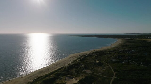 Blue sky and sea on sunny summer day on the west coast of Sweden, drone view panning left