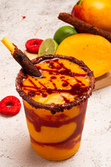 Mangonada, typical mexican mango smoothie with chamoy sauce and lime juice.