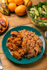 Rice congri with pork fricassee, salad and fried ripe plantain. Typical Cuban food.