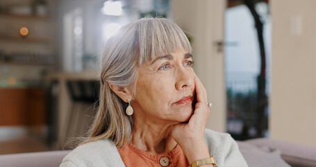 Senior woman, thinking and sad in lounge, hand and memory of past, retirement and depression in...