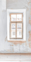 Window in an empty room with neutral tones. Home interiors with copy space.