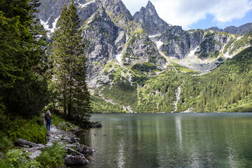 Landscape with lake and mountains. Tatra mountain massif. Lake "Sea Eye" in the Tatra Mountains, Poland. Morskie Oko. Mountain lake. Reflection. Panorama of mountains. Lake in the mountains © Liubov Kartashova