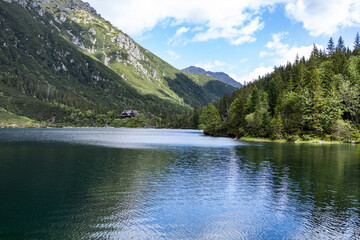 Landscape with lake and mountains. Tatra mountain massif. Lake "Sea Eye" in the Tatra Mountains, Poland. Morskie Oko. Mountain lake. Reflection. Panorama of mountains. Lake in the mountains © Liubov Kartashova