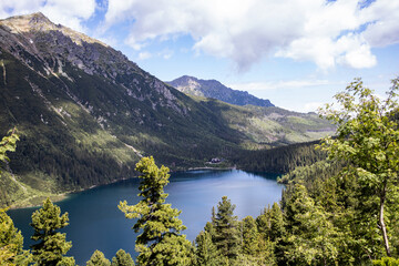 Landscape with lake and mountains. Tatra mountain massif. Lake "Sea Eye" in the Tatra Mountains, Poland. Morskie Oko. Mountain lake. Reflection. Panorama of mountains. Lake in the mountains © Liubov Kartashova