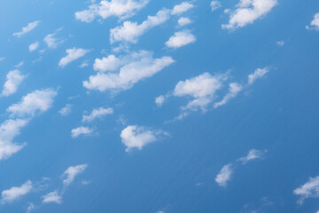 Clouds photographed from an airplane，Cumulus clouds are clouds that have flat bases and are often...
