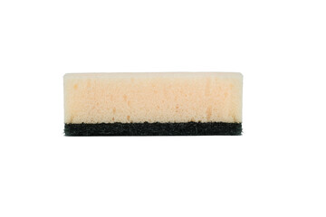 A cleaning sponge with a white foam top and black scrubbing bottom, isolated on a white background