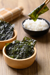 Dried seaweed sheet eating with rice, Asian food © nungning20