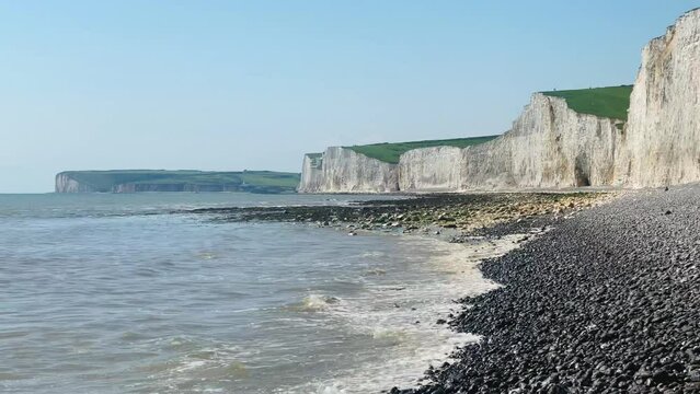 Seven Sisters chalk cliffs, Birling Gap near Eastbourne in East Sussex, famous, landmark, beach landscape, nature and sea coast, spring summer travel concept