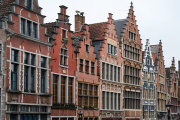 Fototapeta premium Capturing the architectural beauty, this image showcases a row of historic European buildings with detailed facades and distinct styles
