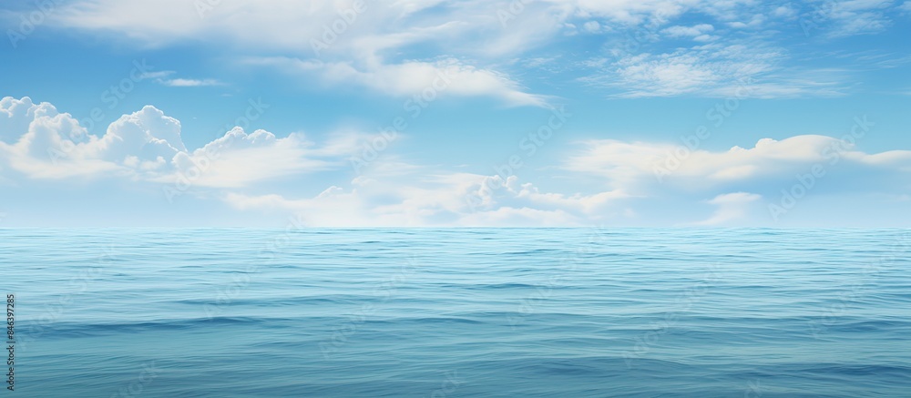Poster a copy space image is available with a cloudy sky and a calm clear ocean