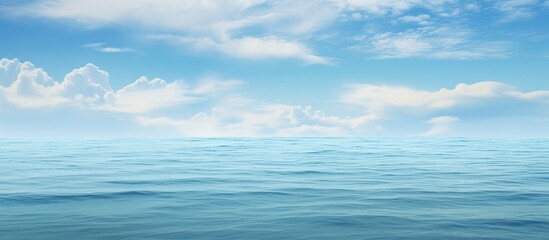 A copy space image is available with a cloudy sky and a calm clear ocean