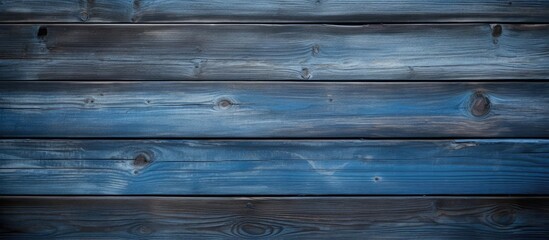 Obraz premium A blue panel with a wood texture creates a captivating background in this copy space image