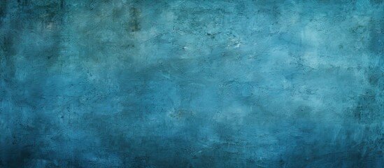 Obraz premium An abstract grunge background featuring a blue decorative plaster texture and a vignette effect It provides ample copy space for design purposes