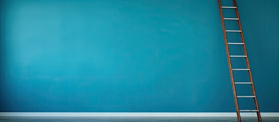 A blue walled empty room with a ladder providing ample copy space for creative use