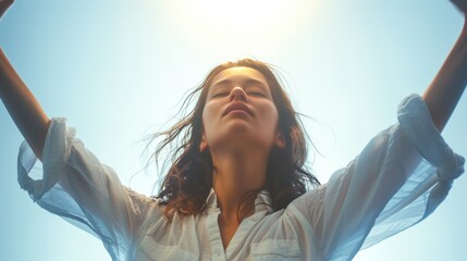 Naklejka premium Portrait of a Determined Woman Raising Her Arms Up Towards the Sky in a Gesture of Triumph