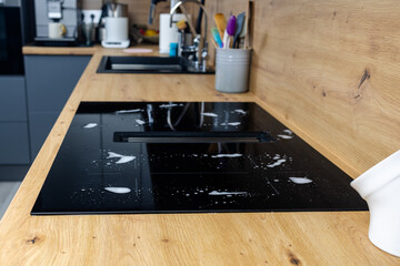 Detergent stains on the stove, cleaning, washing the stove, cleaning the kitchen