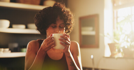 Woman, home and kitchen with cup of coffee on morning for breakfast, relax and enjoy. Female...